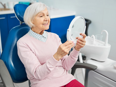 Woman smiling at the dentist