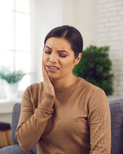 Closeup of woman experiencing toothache at home